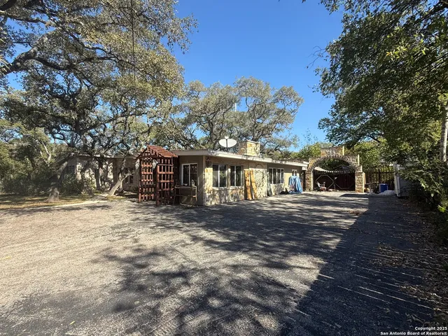 a dining room with furniture and a window