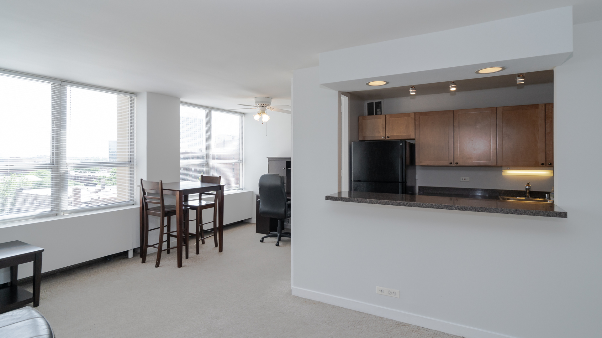 655 West Irving Park Road, Unit 803 Chicago, IL 60613 - Photo 3 of 25 a view of dining room with furniture and window
