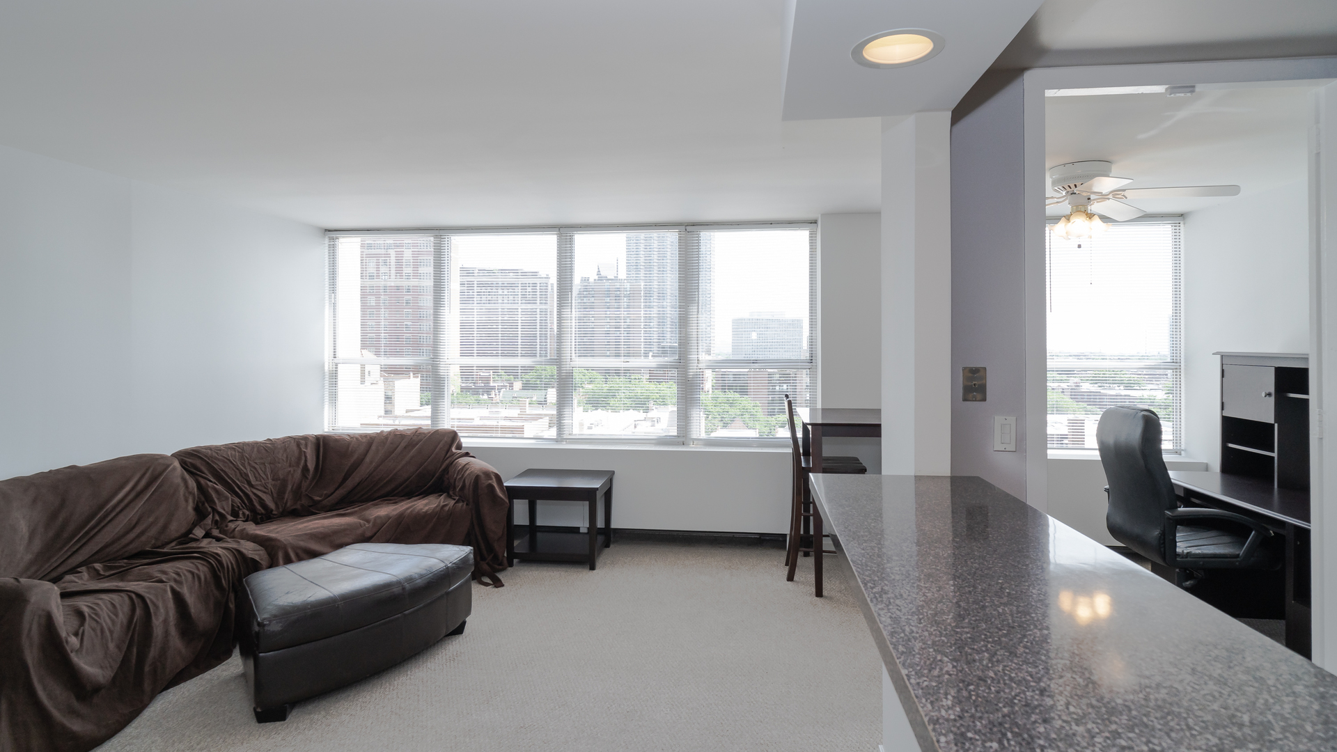 655 West Irving Park Road, Unit 803 Chicago, IL 60613 - Photo 4 of 25 a living room with furniture and a large window