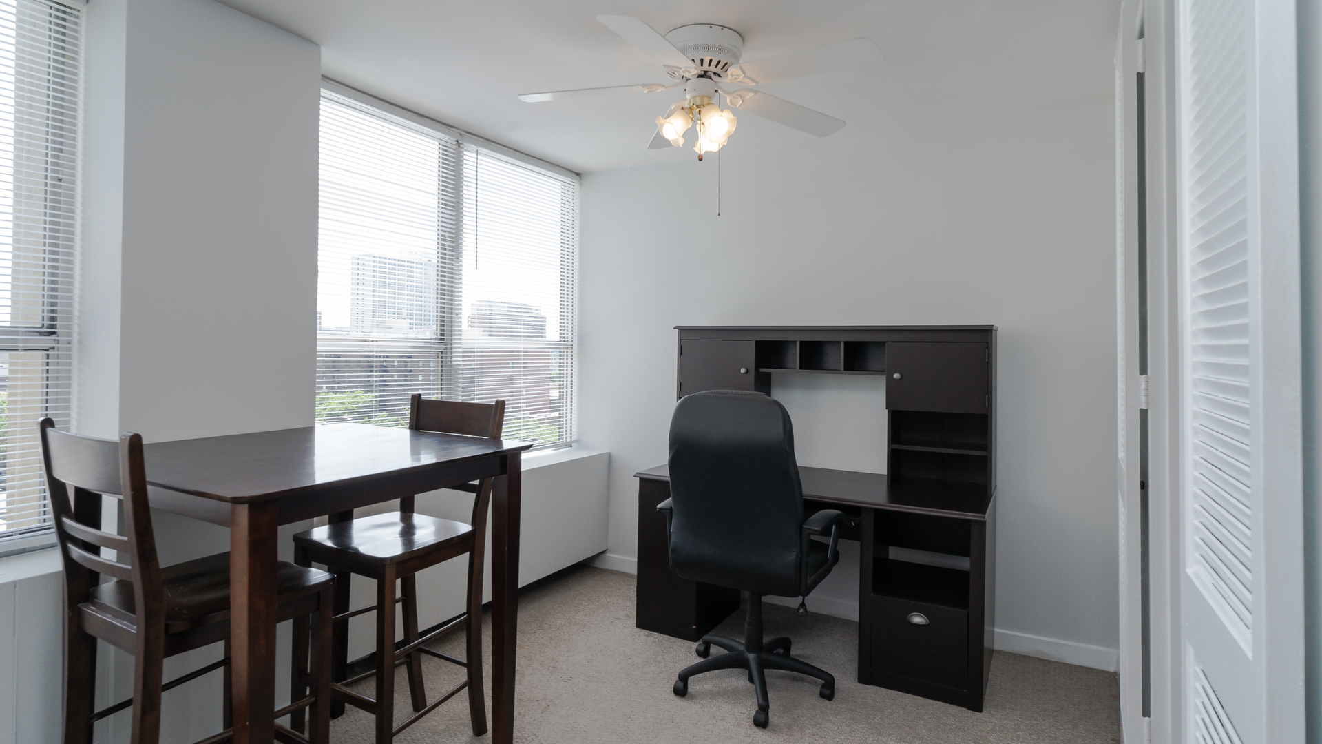 655 West Irving Park Road, Unit 803 Chicago, IL 60613 - Photo 5 of 25 a view of a workspace with furniture and a window
