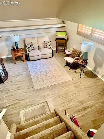 a living room with furniture and a rug