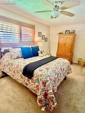 a bedroom with bed and window