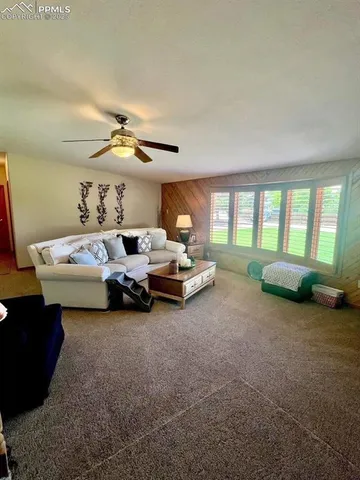 a spacious bedroom with a bed and a couch