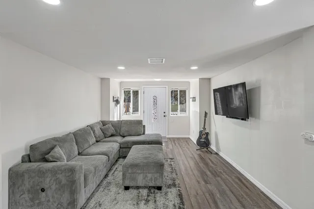 a kitchen with stainless steel appliances kitchen island granite countertop a sink and cabinets