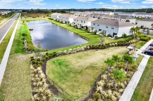 an aerial view of a swimming pool with outdoor space