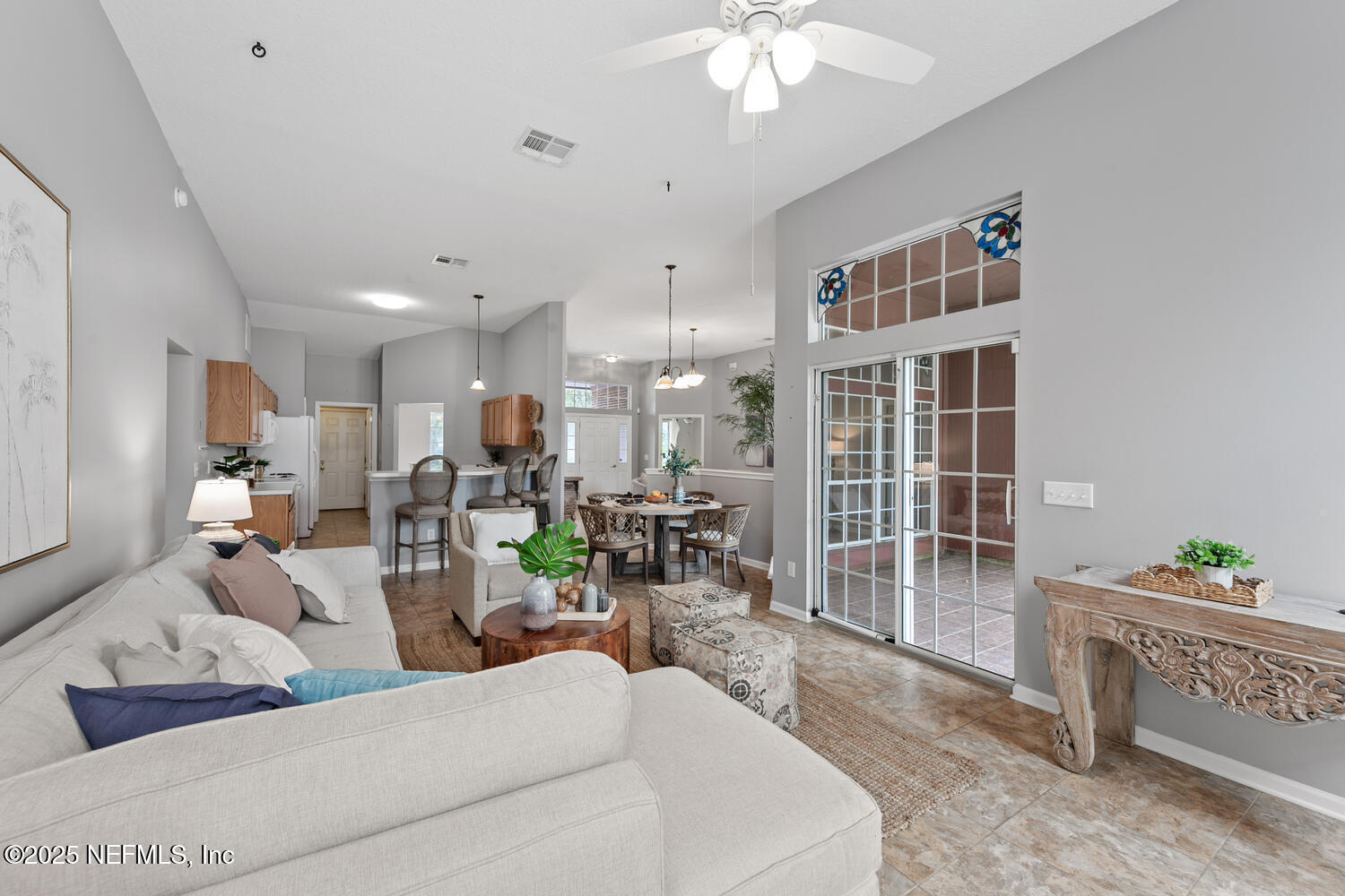113 Nottingham Drive St. Johns, FL 32259 - Photo 35 of 35 a living room with furniture and a chandelier