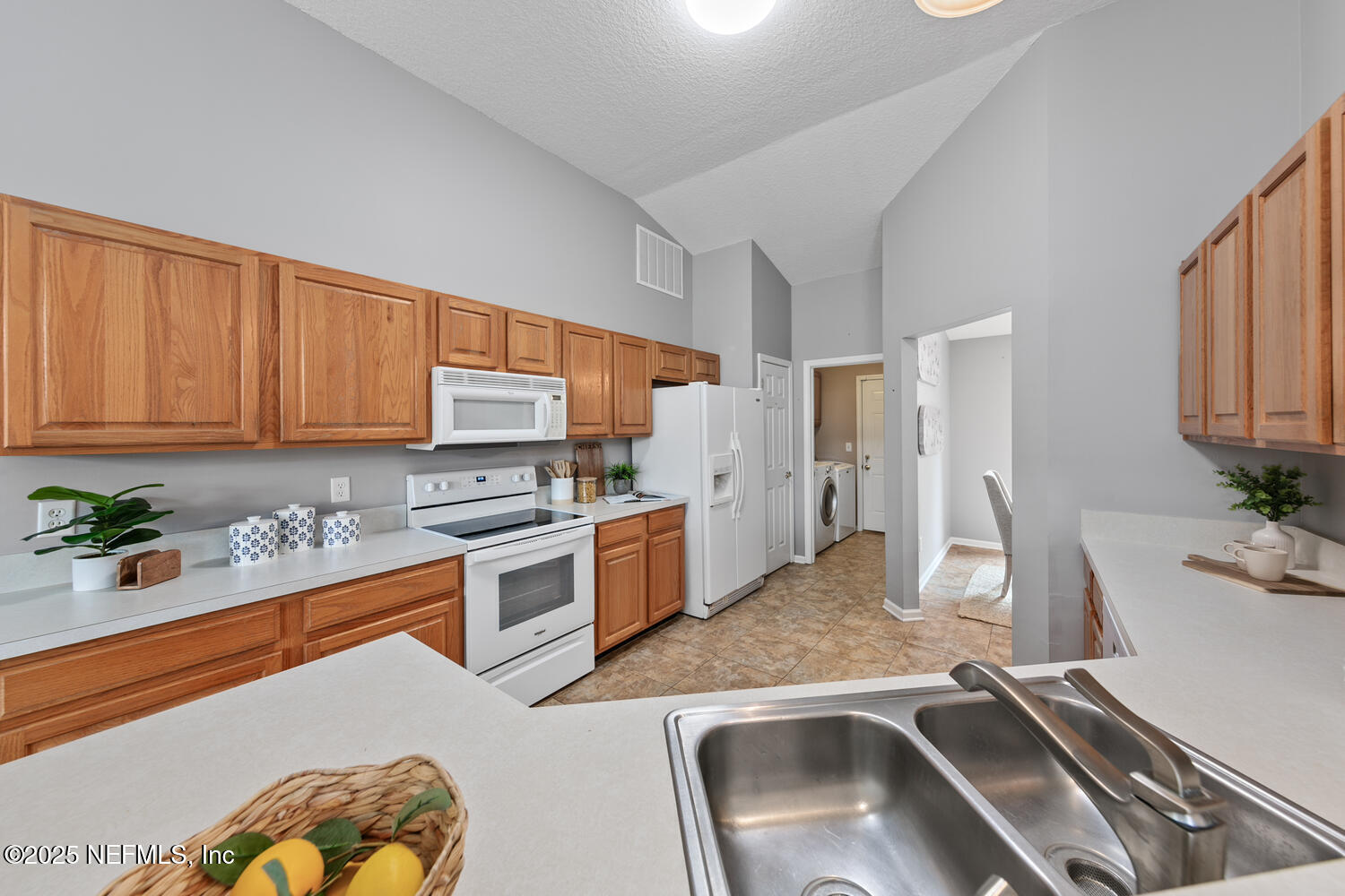 113 Nottingham Drive St. Johns, FL 32259 - Photo 14 of 35 a kitchen with a sink stove and refrigerator