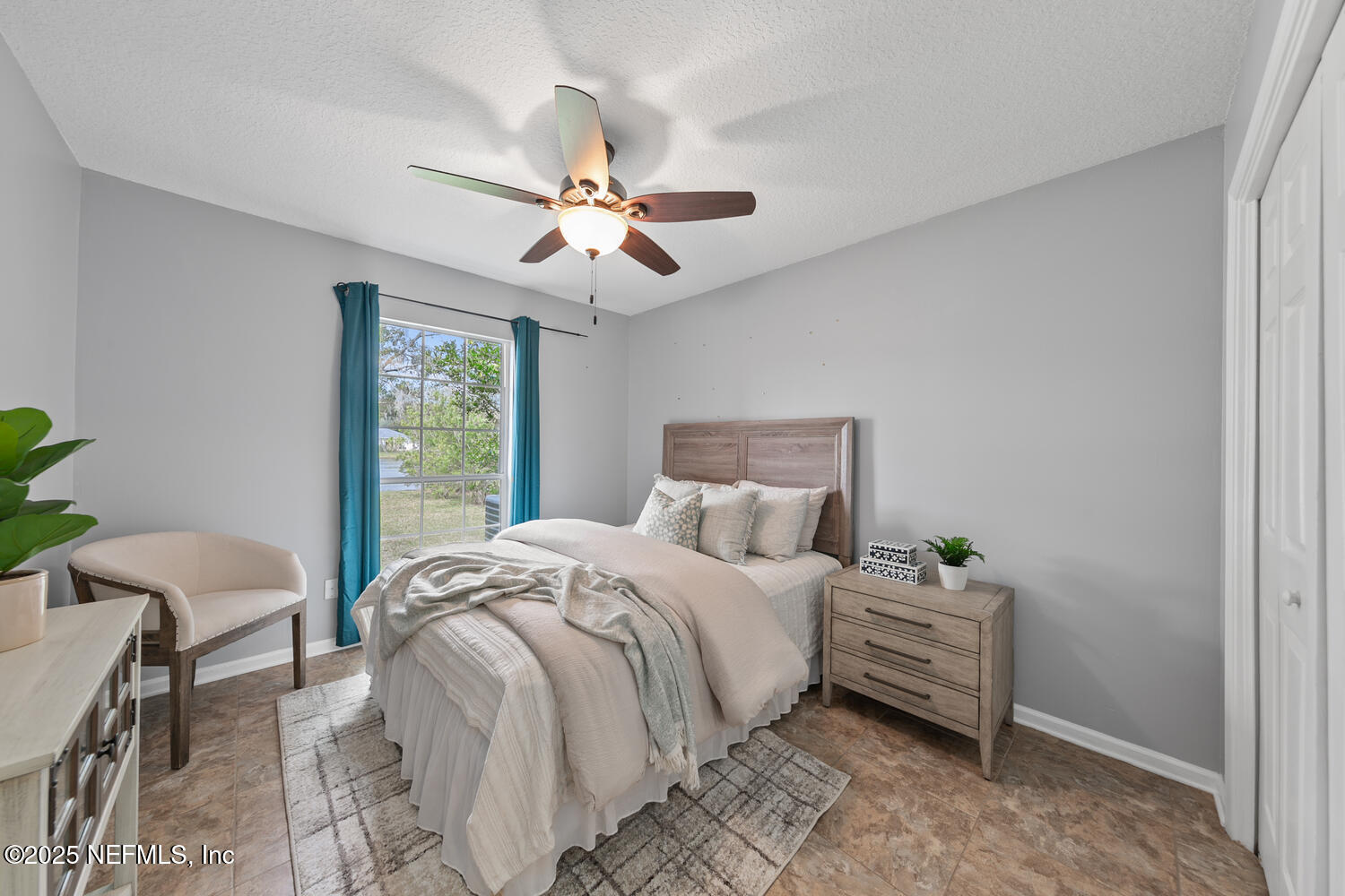 113 Nottingham Drive St. Johns, FL 32259 - Photo 22 of 35 a bedroom with a bed and a chandelier