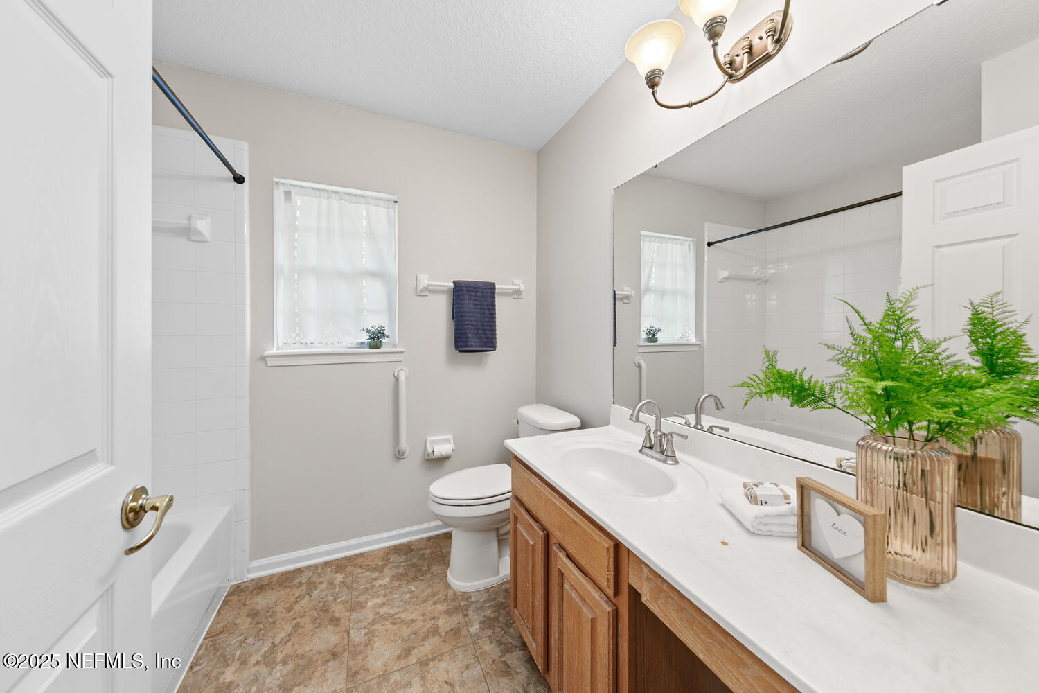 113 Nottingham Drive St. Johns, FL 32259 - Photo 24 of 35 a bathroom with a sink a toilet and mirror