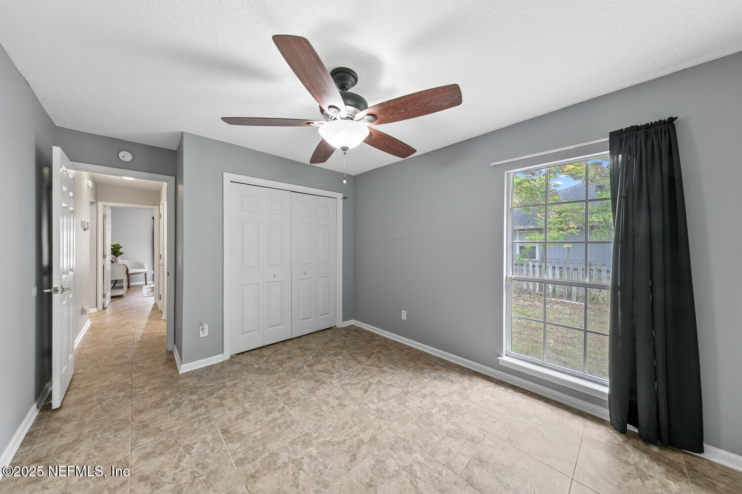 113 Nottingham Drive St. Johns, FL 32259 - Photo 26 of 35 an empty room with fan and windows