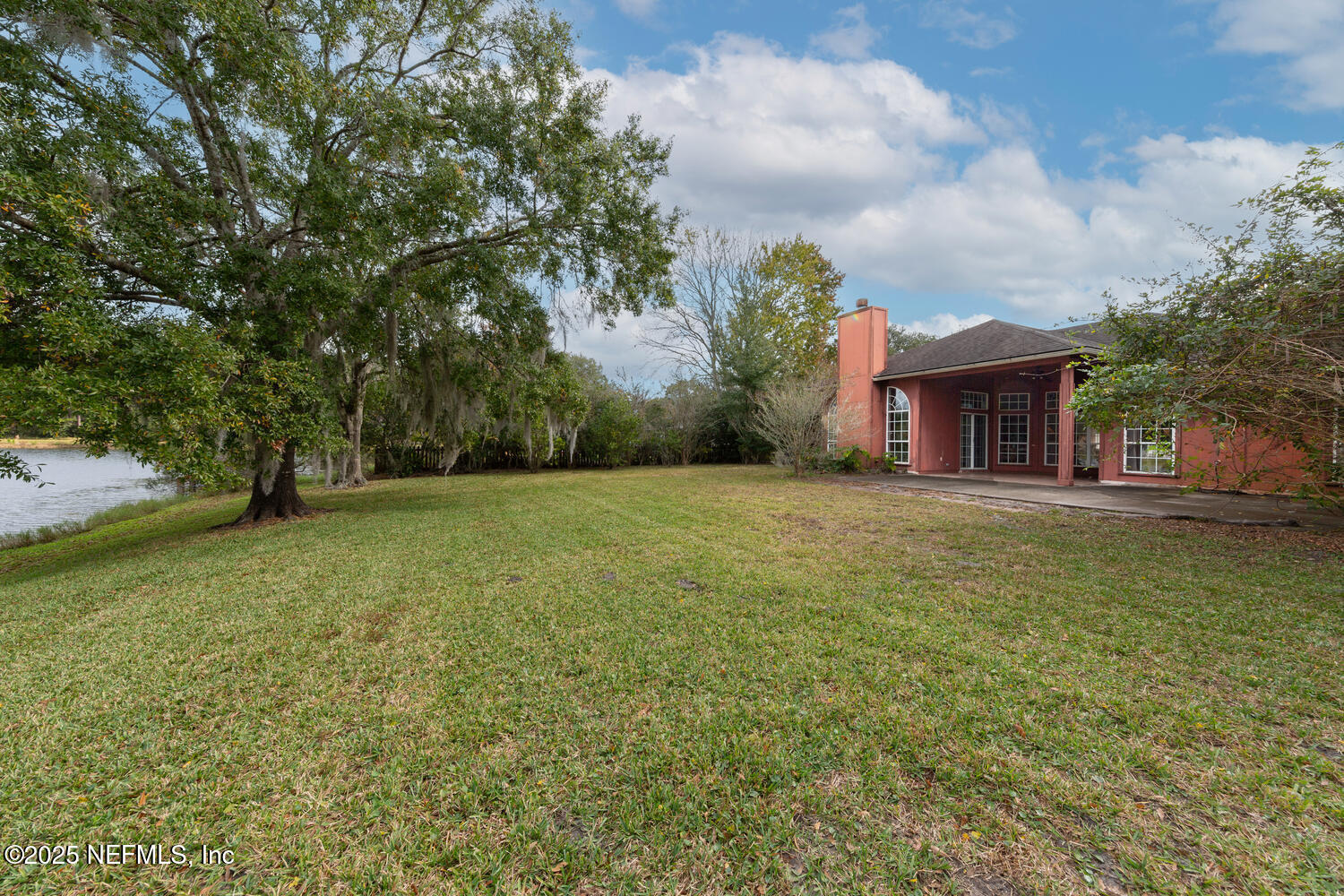 113 Nottingham Drive St. Johns, FL 32259 - Photo 32 of 35 a view of house with garden space and trees in the background