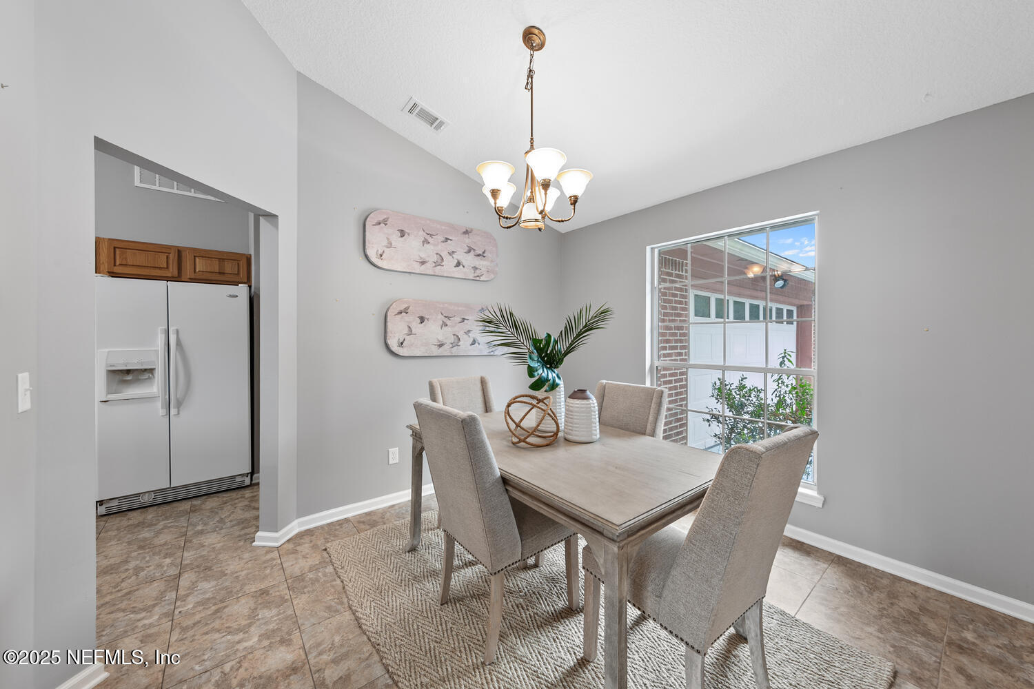 113 Nottingham Drive St. Johns, FL 32259 - Photo 7 of 35 a view of a dining room with furniture a chandelier and wooden floor