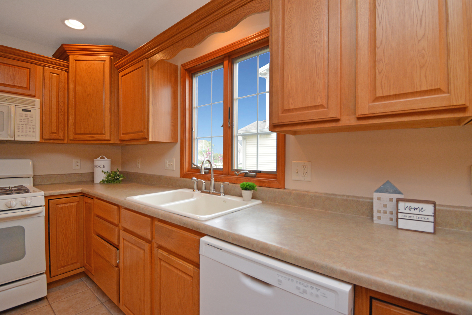2884 Bear Claw Street Normal, IL 61761 - Photo 22 of 62 a kitchen with a sink and cabinets