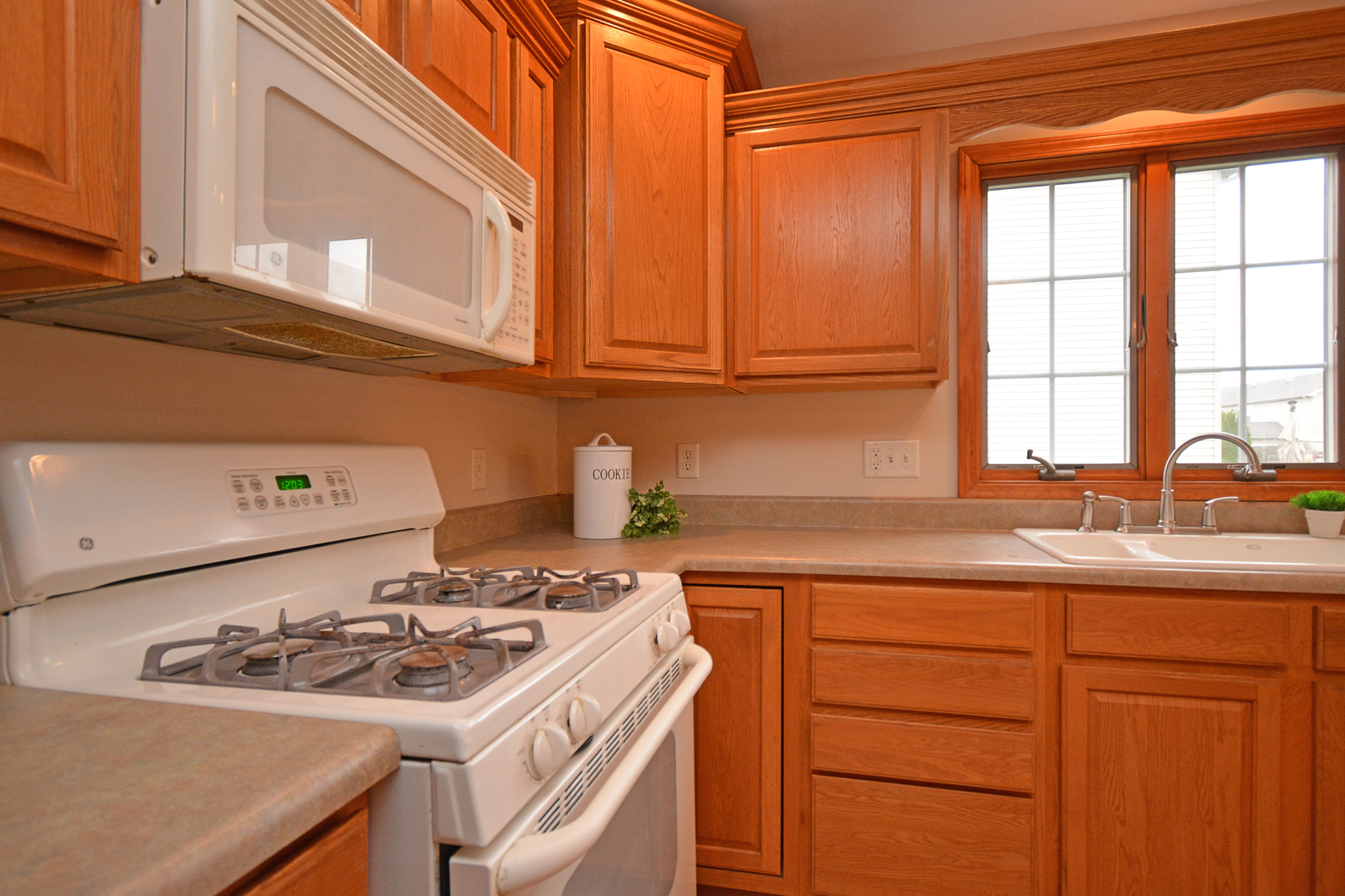 2884 Bear Claw Street Normal, IL 61761 - Photo 27 of 62 a kitchen with a sink stove and cabinets