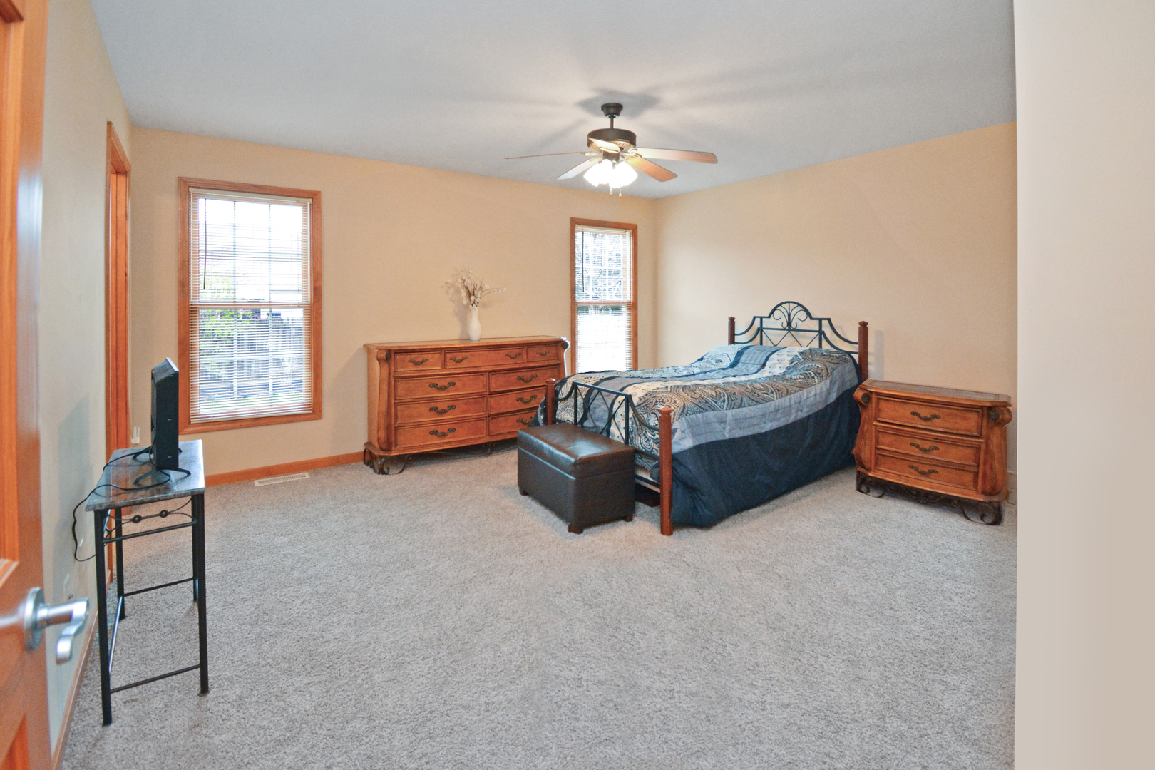 2884 Bear Claw Street Normal, IL 61761 - Photo 29 of 62 a living room with furniture and a chandelier