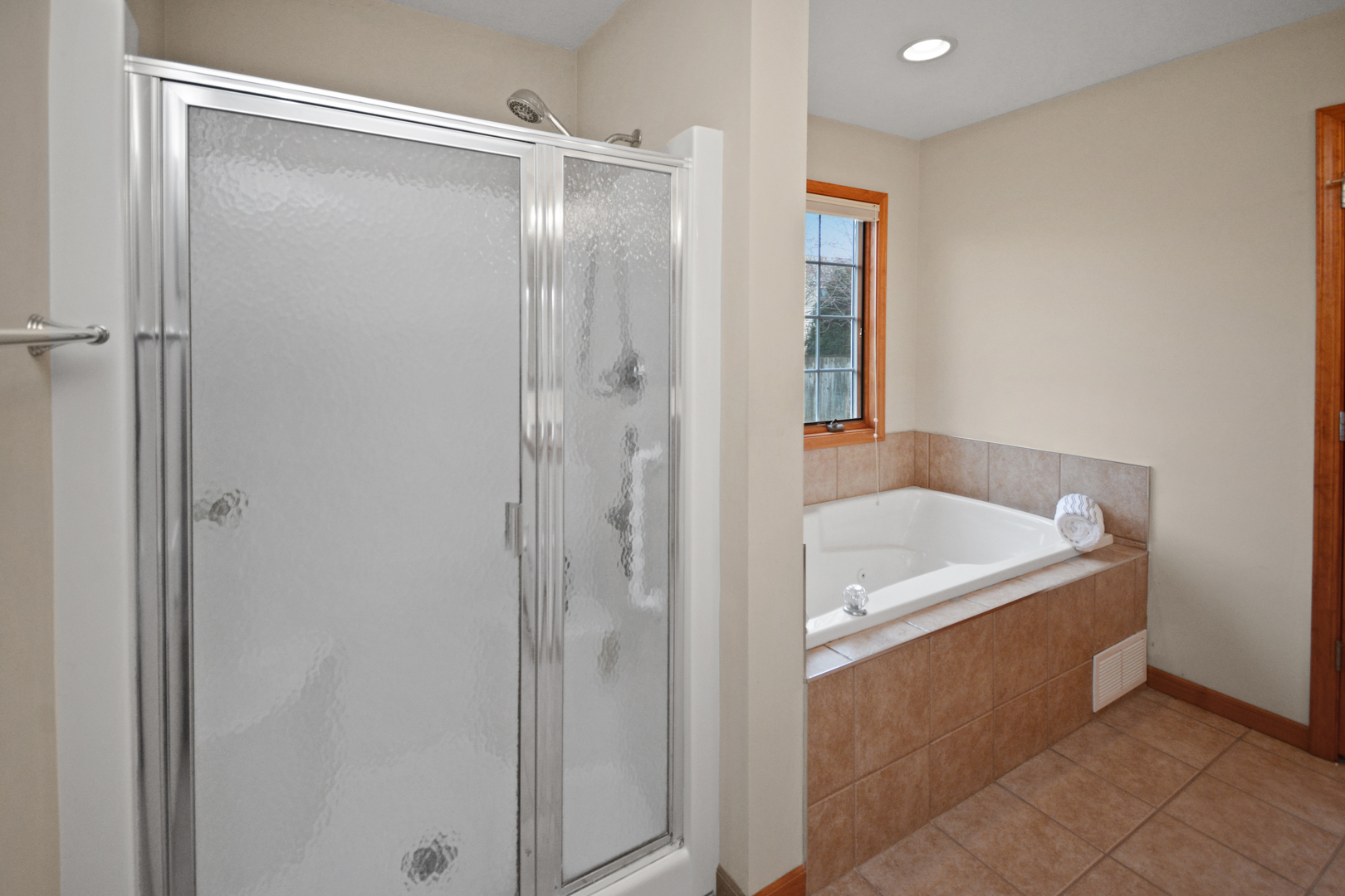 2884 Bear Claw Street Normal, IL 61761 - Photo 36 of 62 a bathroom with a tub shower and a sink