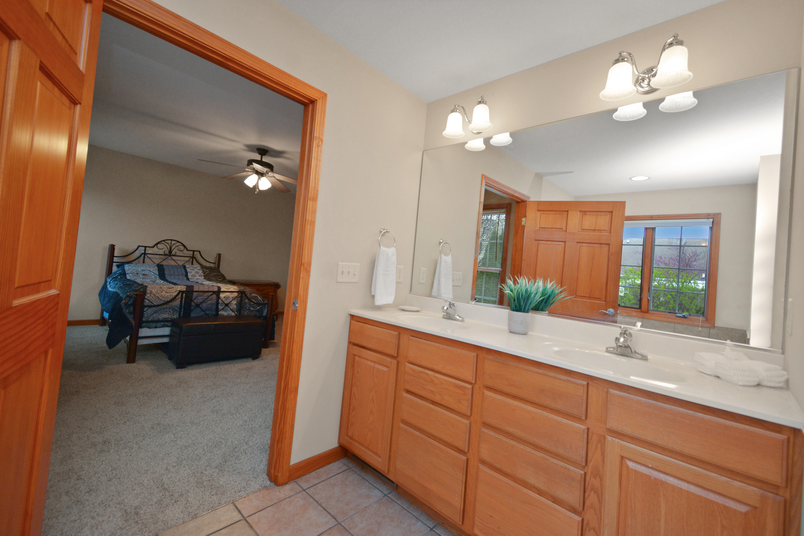 2884 Bear Claw Street Normal, IL 61761 - Photo 41 of 62 a en suite bathroom with double vanity and mirrors