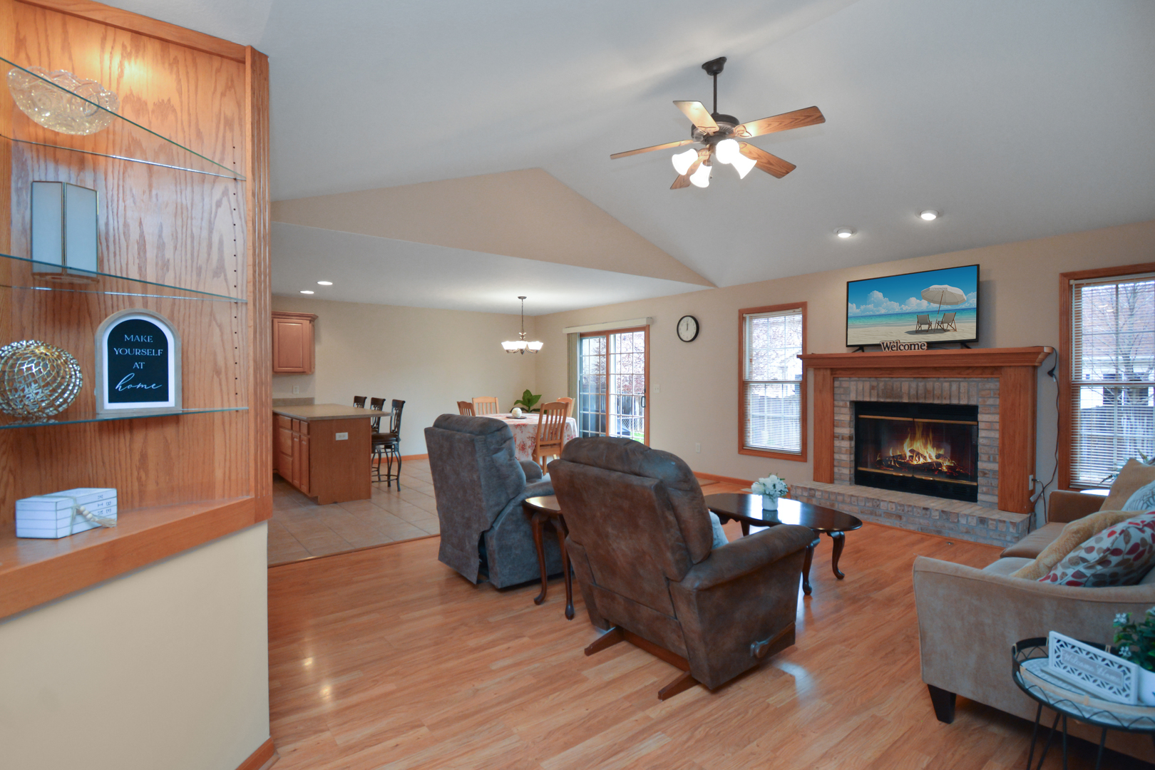 2884 Bear Claw Street Normal, IL 61761 - Photo 48 of 62 a living room with furniture and a fireplace