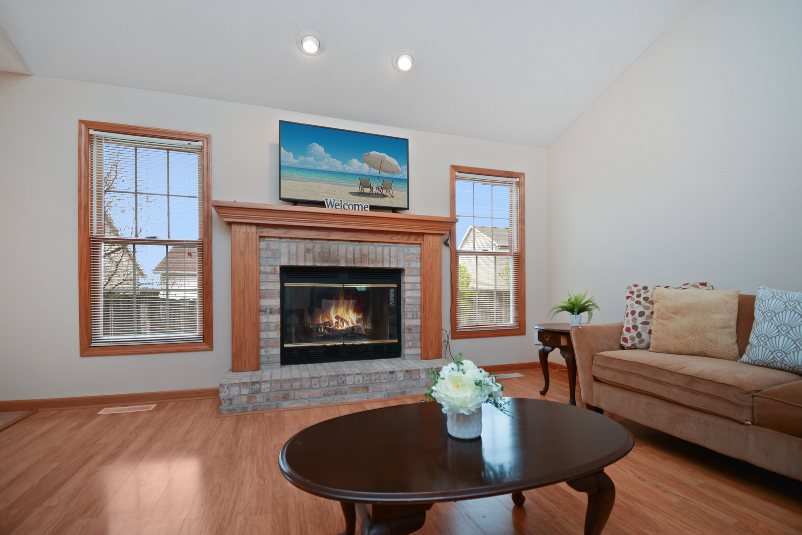 2884 Bear Claw Street Normal, IL 61761 - Photo 52 of 62 a living room with furniture and a fireplace