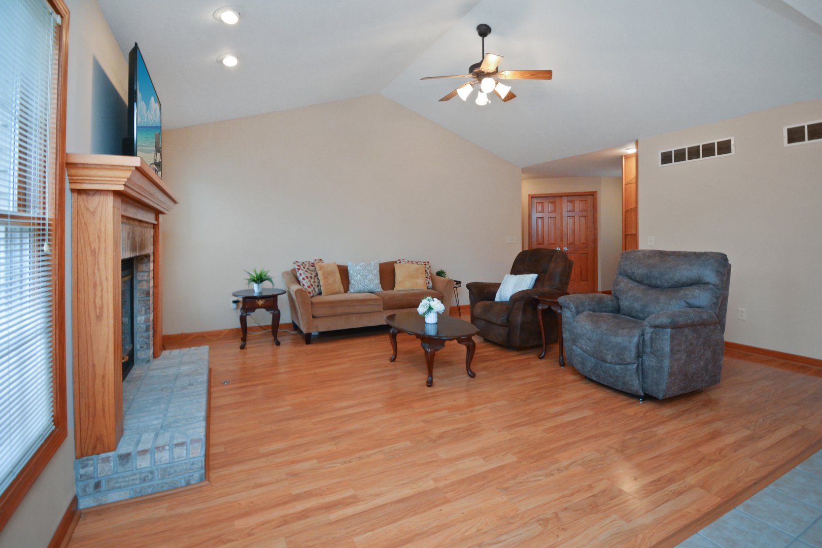2884 Bear Claw Street Normal, IL 61761 - Photo 53 of 62 a living room with furniture and a fireplace