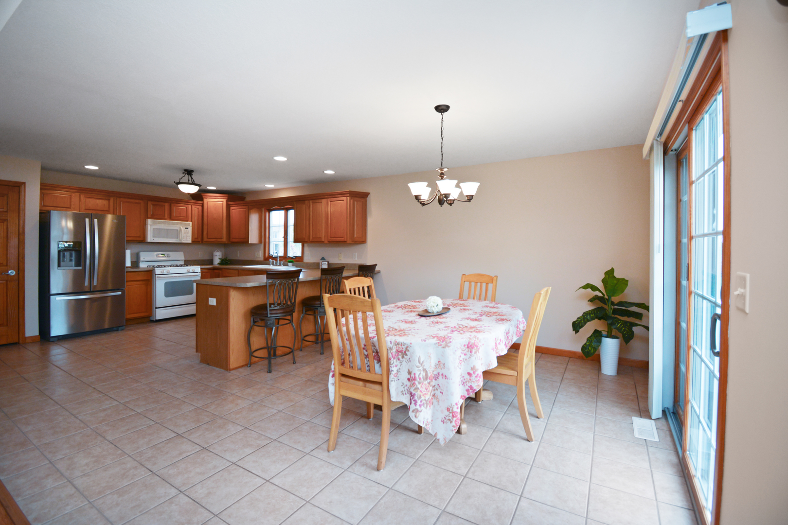 2884 Bear Claw Street Normal, IL 61761 - Photo 58 of 62 a view of a dining room with furniture