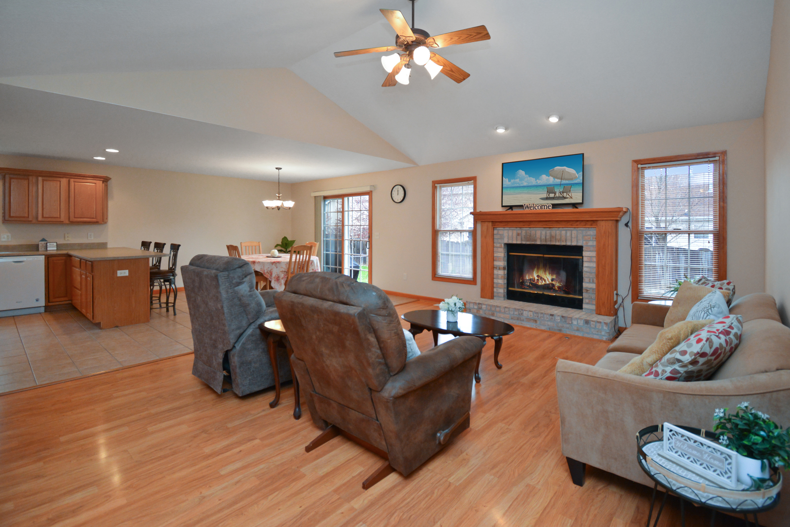 2884 Bear Claw Street Normal, IL 61761 - Photo 7 of 62 a living room with furniture and a fireplace