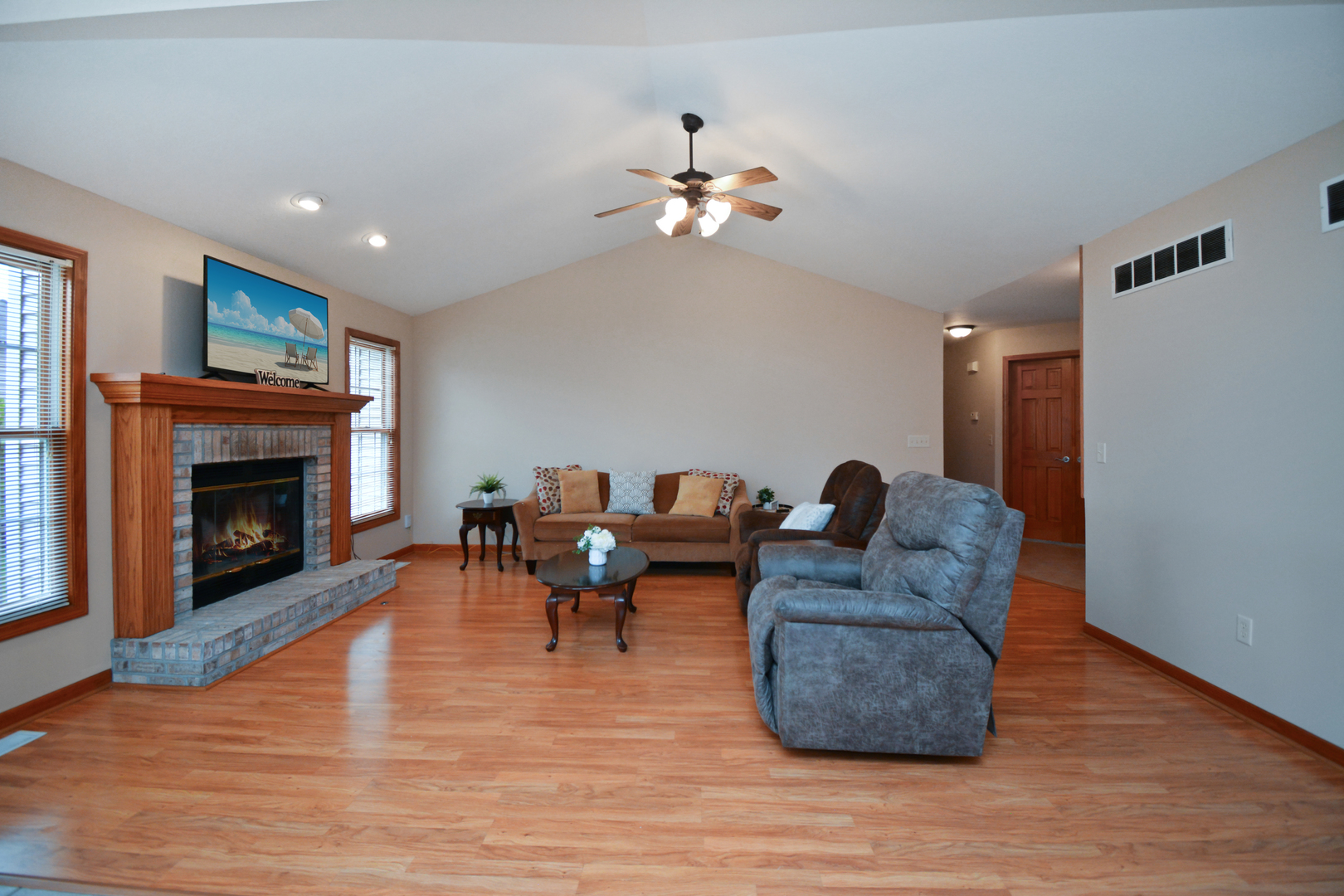 2884 Bear Claw Street Normal, IL 61761 - Photo 10 of 62 a living room with furniture and a fireplace