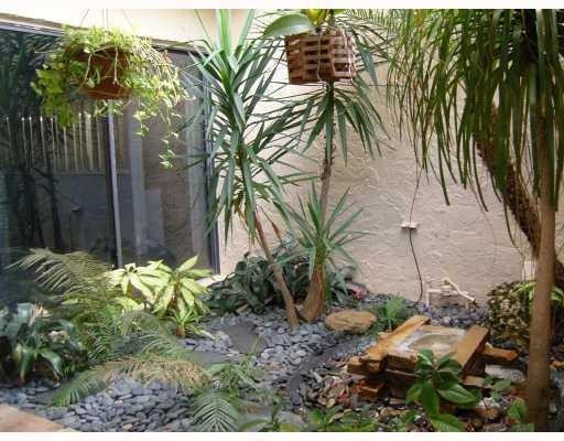 406 St Andrews Road, Unit 53 Hollywood, FL 33021 - Photo 2 of 2 a plant that is in front of a house