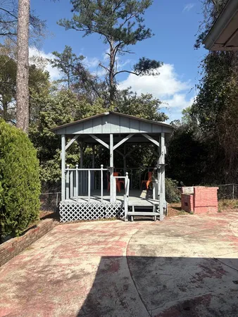 a view of a house with snow on the wall