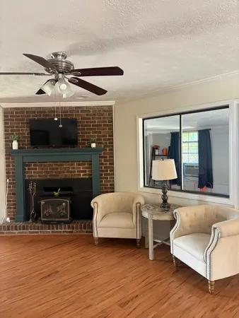 a living room with furniture and a fireplace