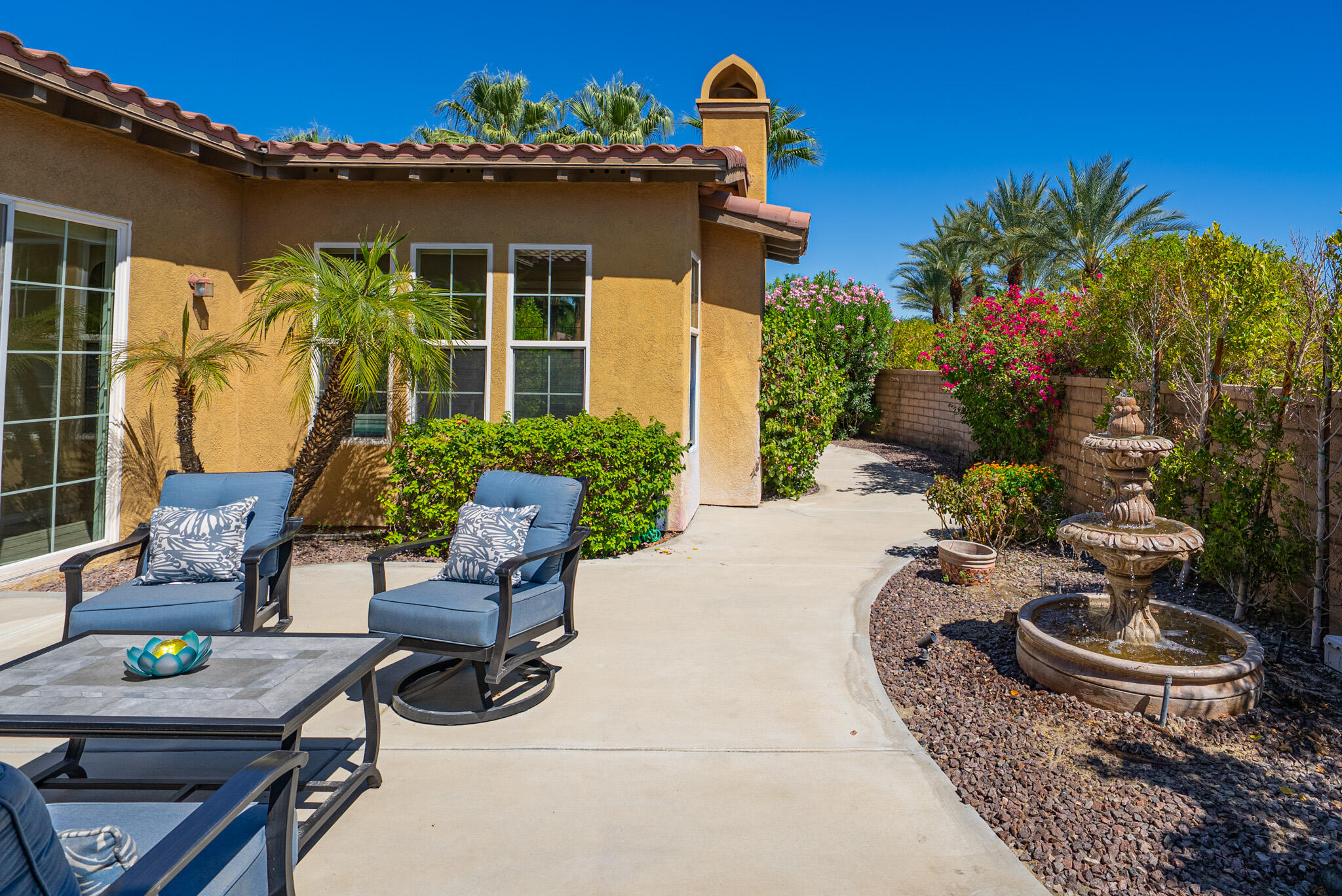 14 Via Santo Tomas Drive Rancho Mirage, CA 92270 - Photo 48 of 61 a view of a backyard with chair and potted plants
