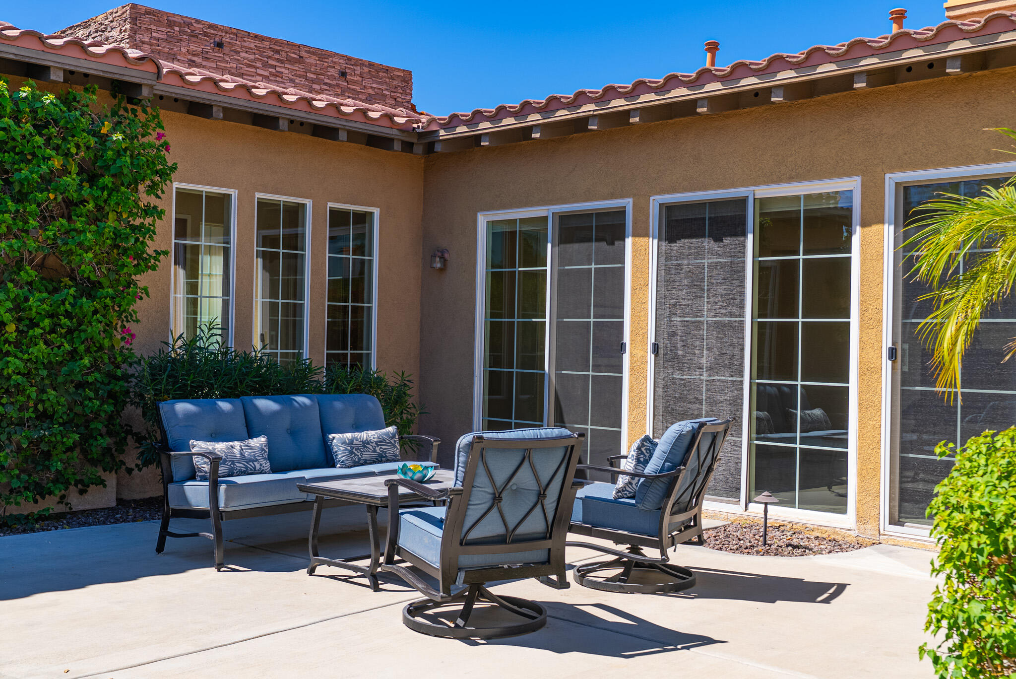 14 Via Santo Tomas Drive Rancho Mirage, CA 92270 - Photo 52 of 61 a view of a dinning table and chair in patio of the house