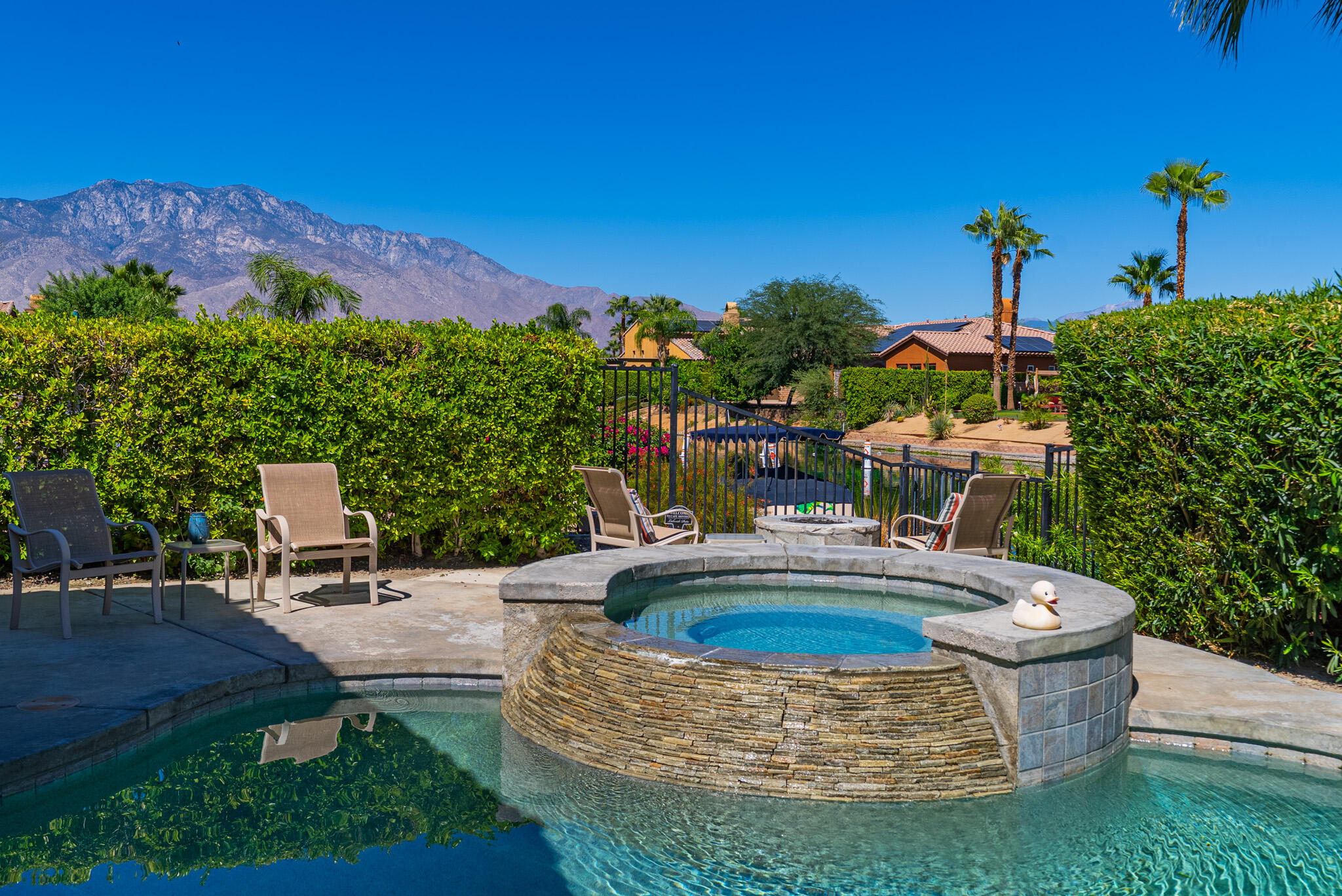 14 Via Santo Tomas Drive Rancho Mirage, CA 92270 - Photo 7 of 61 a swimming pool with outdoor seating and yard
