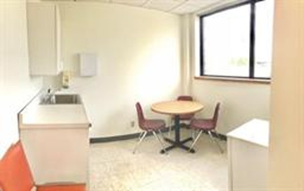 111 Everett Avenue, Unit 1A Chelsea, MA 02150 - Photo 16 of 20 a dining room with furniture and window