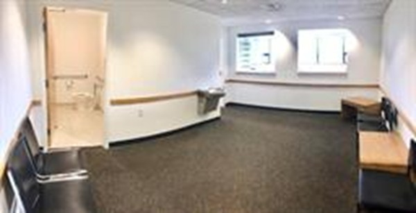 111 Everett Avenue, Unit 1A Chelsea, MA 02150 - Photo 5 of 20 a view of a room that has a bed and a window