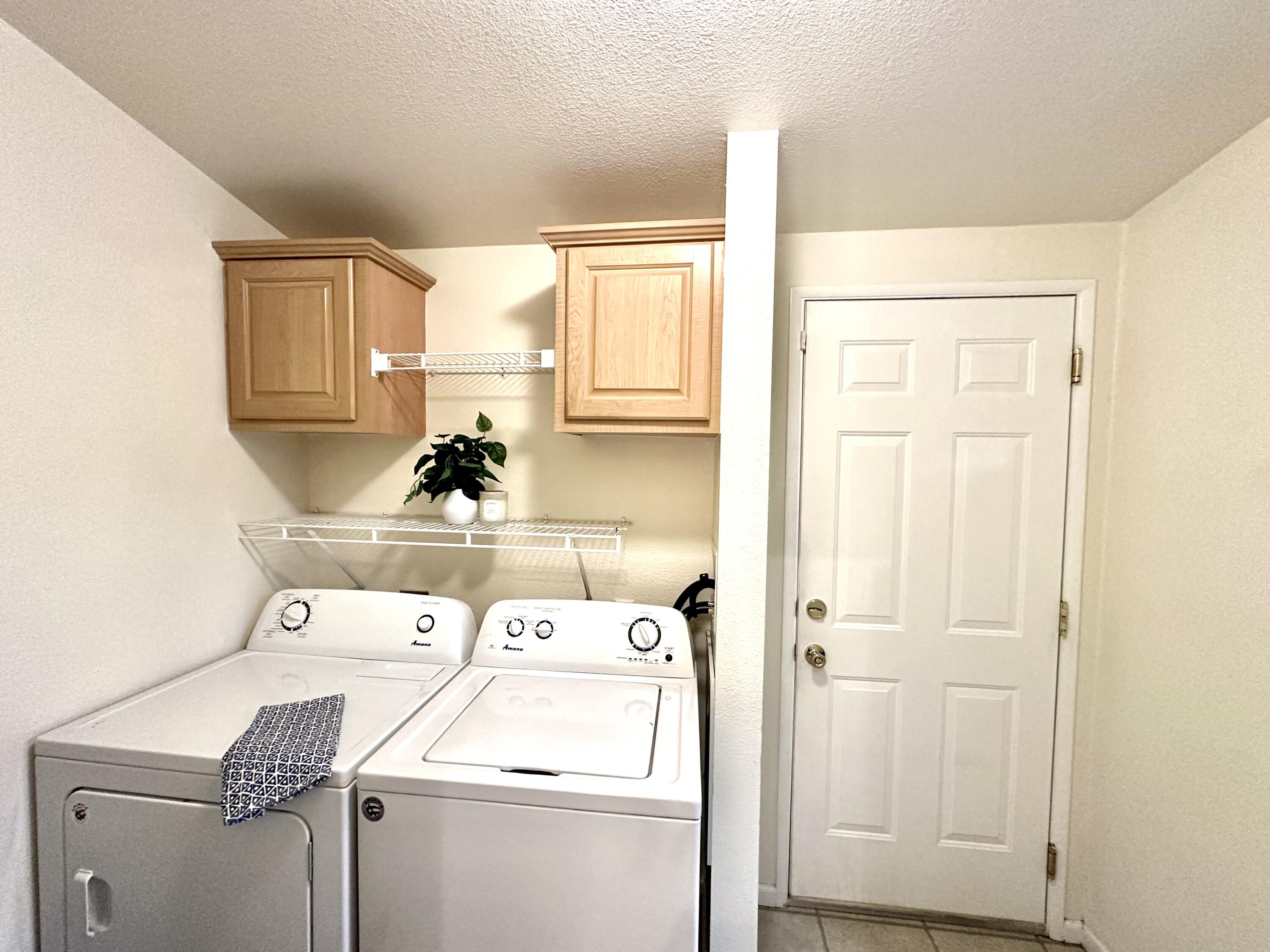 4713 Maple Trail, Unit LOS ROBLES ESTATES Redding, CA 96003 - Photo 11 of 22 a utility room with dryer and washer