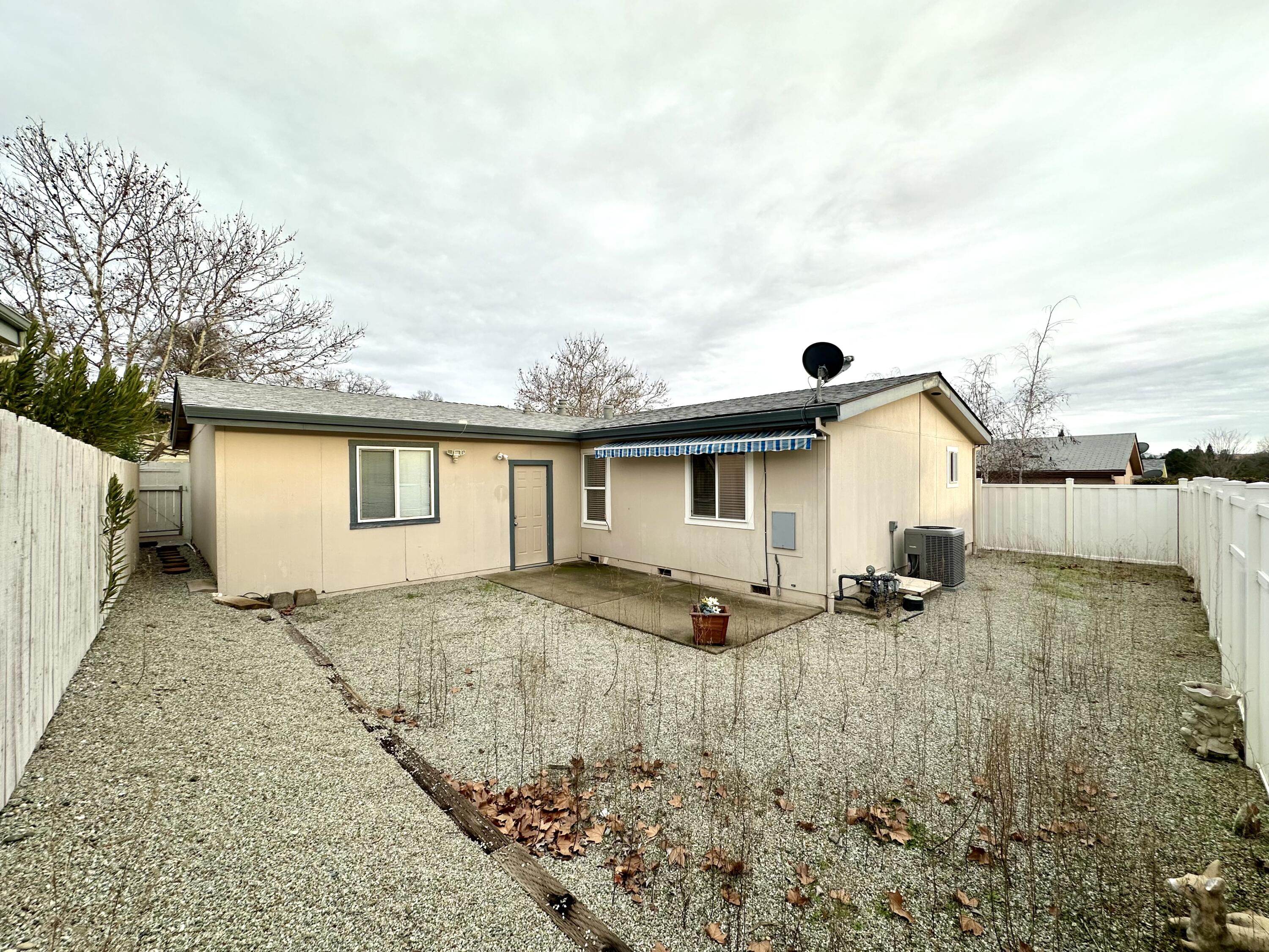 4713 Maple Trail, Unit LOS ROBLES ESTATES Redding, CA 96003 - Photo 21 of 22 a view of backyard of the house
