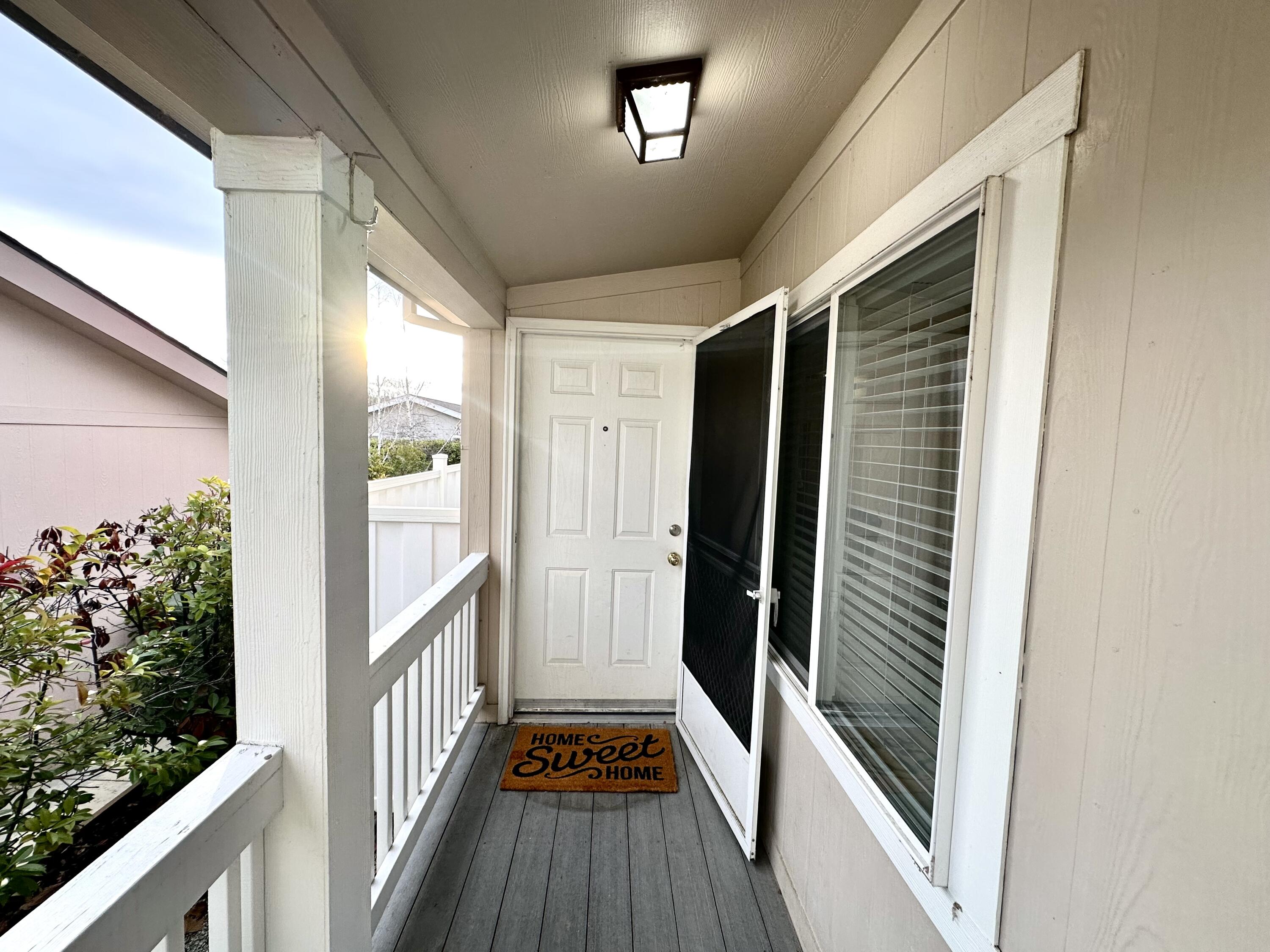 4713 Maple Trail, Unit LOS ROBLES ESTATES Redding, CA 96003 - Photo 5 of 22 a view of a balcony with wooden floor