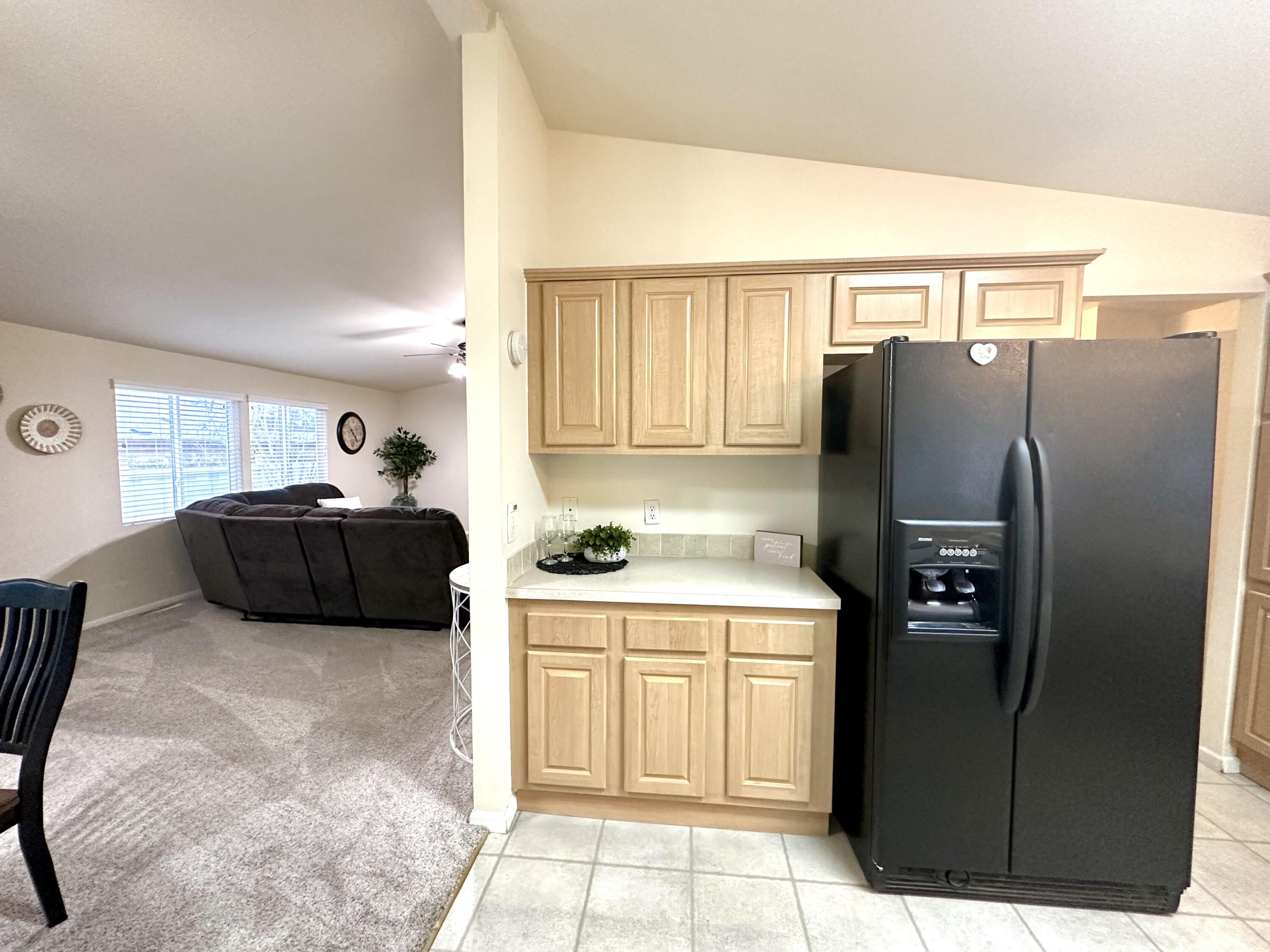 4713 Maple Trail, Unit LOS ROBLES ESTATES Redding, CA 96003 - Photo 7 of 22 a kitchen with stainless steel appliances a refrigerator and a more cabinets