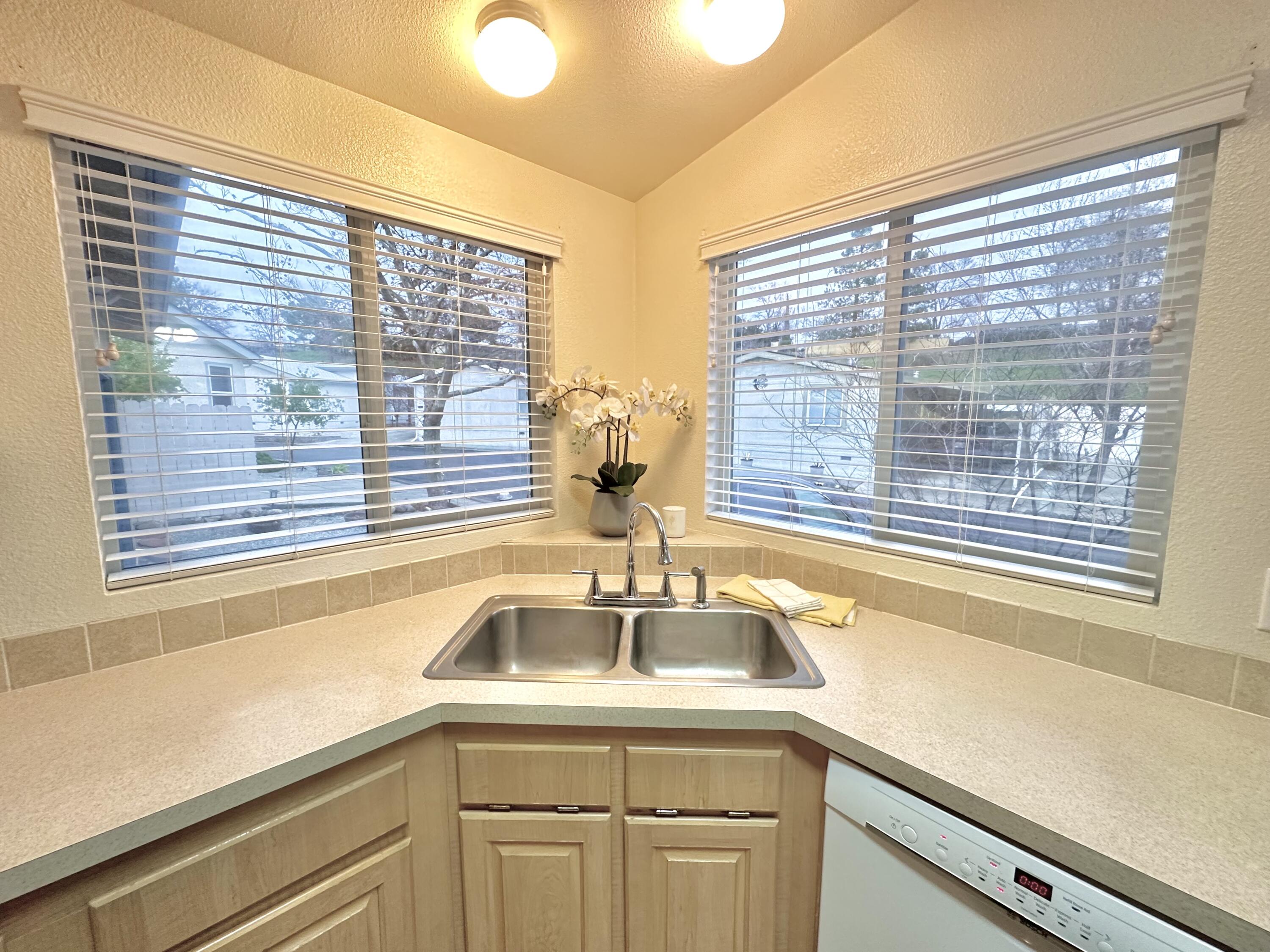 4713 Maple Trail, Unit LOS ROBLES ESTATES Redding, CA 96003 - Photo 10 of 22 a view of a sink and a window