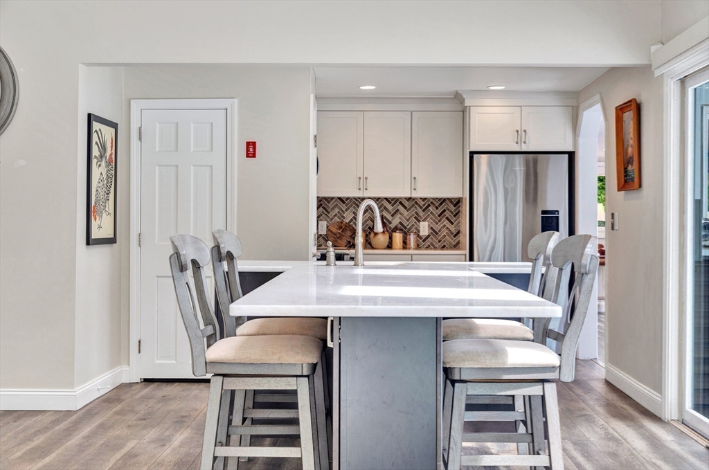 118 Woolford Road Wrentham, MA 02093 - Photo 13 of 41 a view of a dining room with furniture and a chandelier