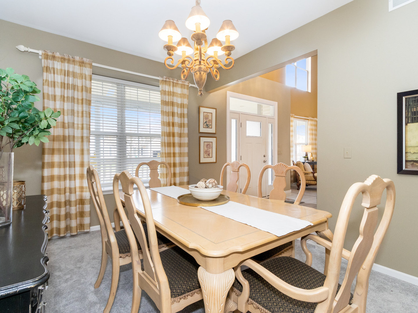 1195 Amaranth Drive Naperville, IL 60564 - Photo 13 of 48 a view of a dining room with furniture and chandelier