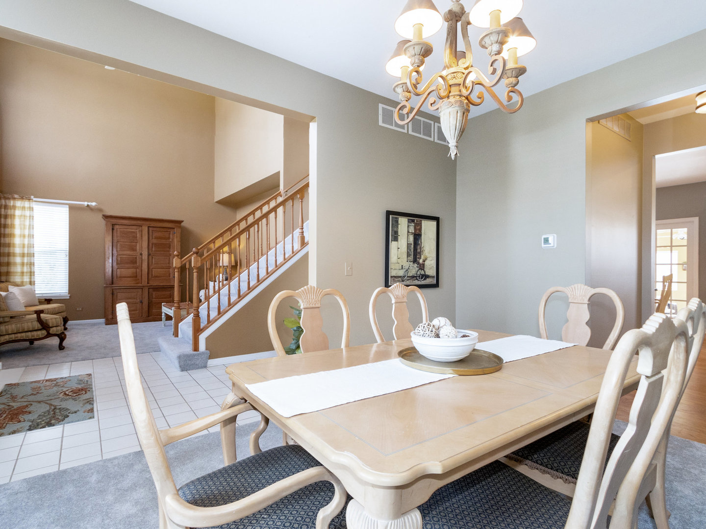1195 Amaranth Drive Naperville, IL 60564 - Photo 15 of 48 a view of a dining room with furniture and chandelier