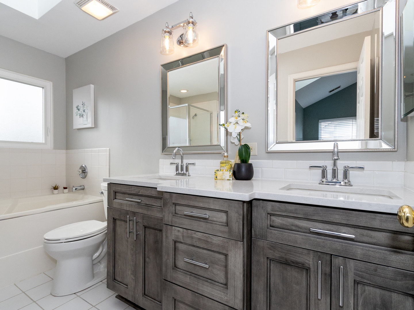 1195 Amaranth Drive Naperville, IL 60564 - Photo 23 of 48 a bathroom with a toilet a sink a mirror and bathtub