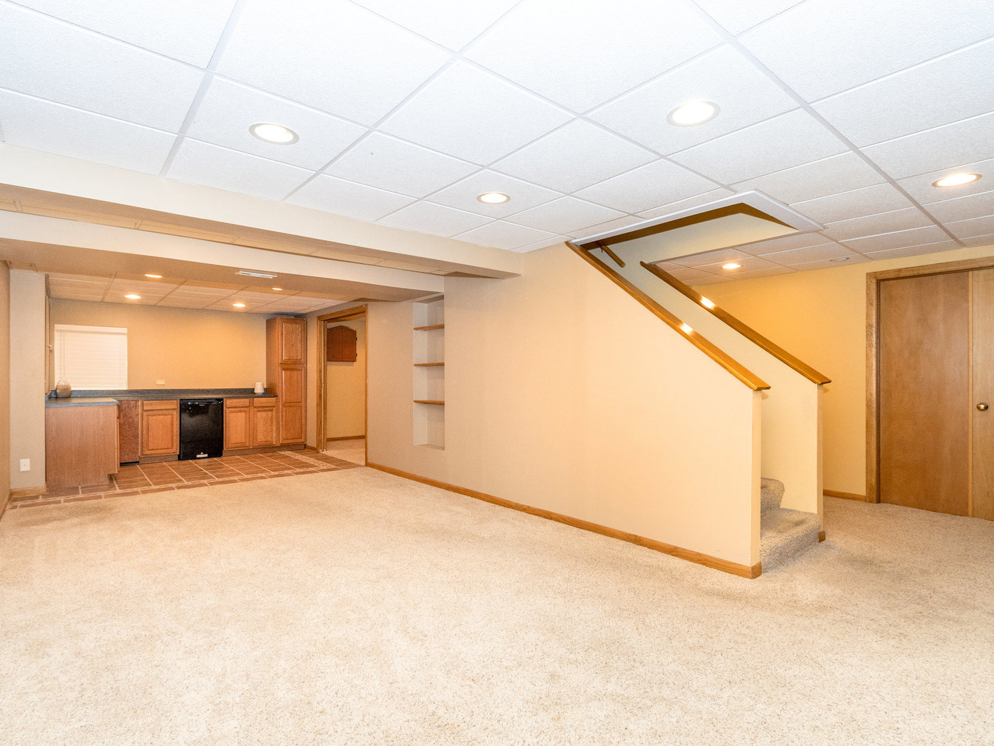1195 Amaranth Drive Naperville, IL 60564 - Photo 29 of 48 a view of an empty room with wooden cabinet