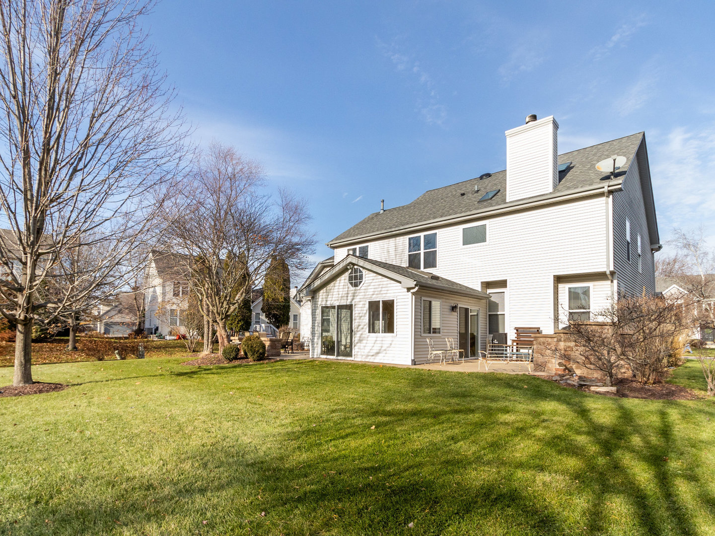 1195 Amaranth Drive Naperville, IL 60564 - Photo 37 of 48 a view of a white house with a big yard and large trees