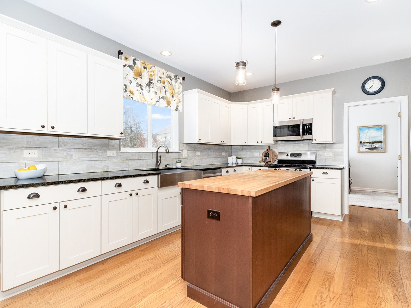 1195 Amaranth Drive Naperville, IL 60564 - Photo 4 of 48 a kitchen with stainless steel appliances granite countertop a stove a sink and a microwave
