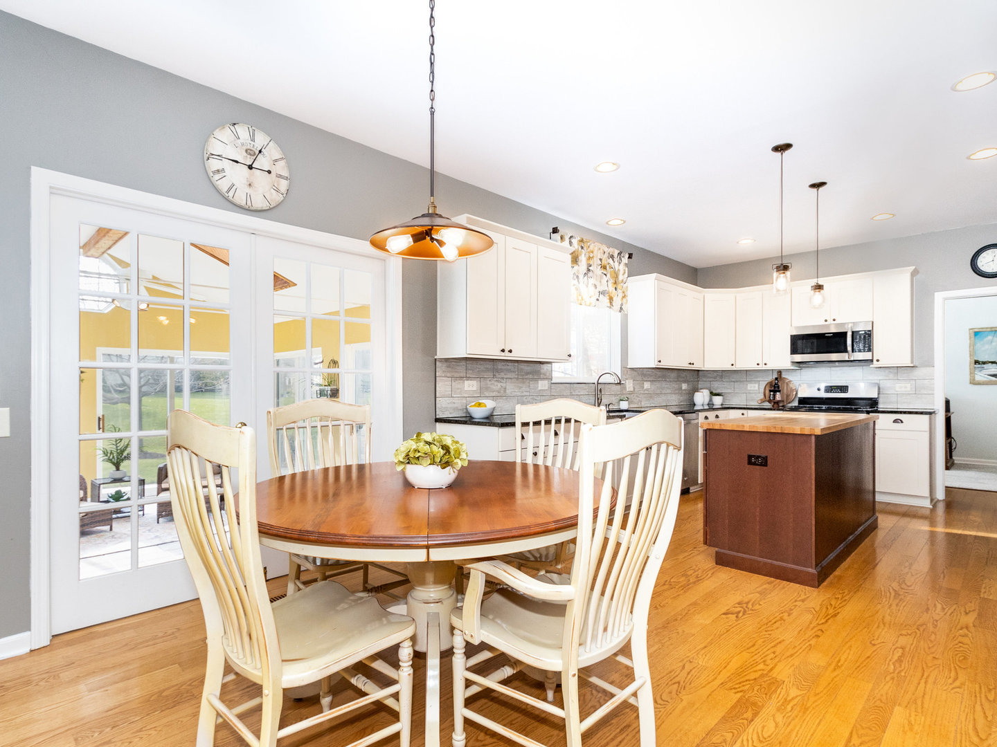 1195 Amaranth Drive Naperville, IL 60564 - Photo 5 of 48 a kitchen with a table and chairs in it