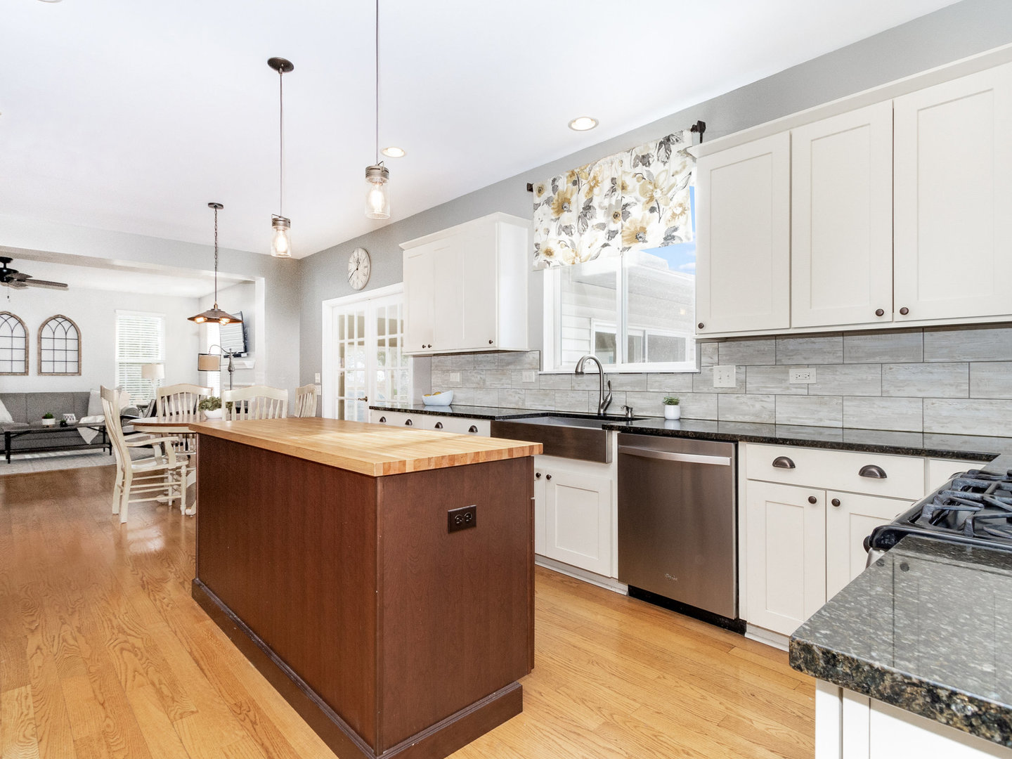 1195 Amaranth Drive Naperville, IL 60564 - Photo 8 of 48 a kitchen with stainless steel appliances granite countertop a sink a stove and a wooden floors
