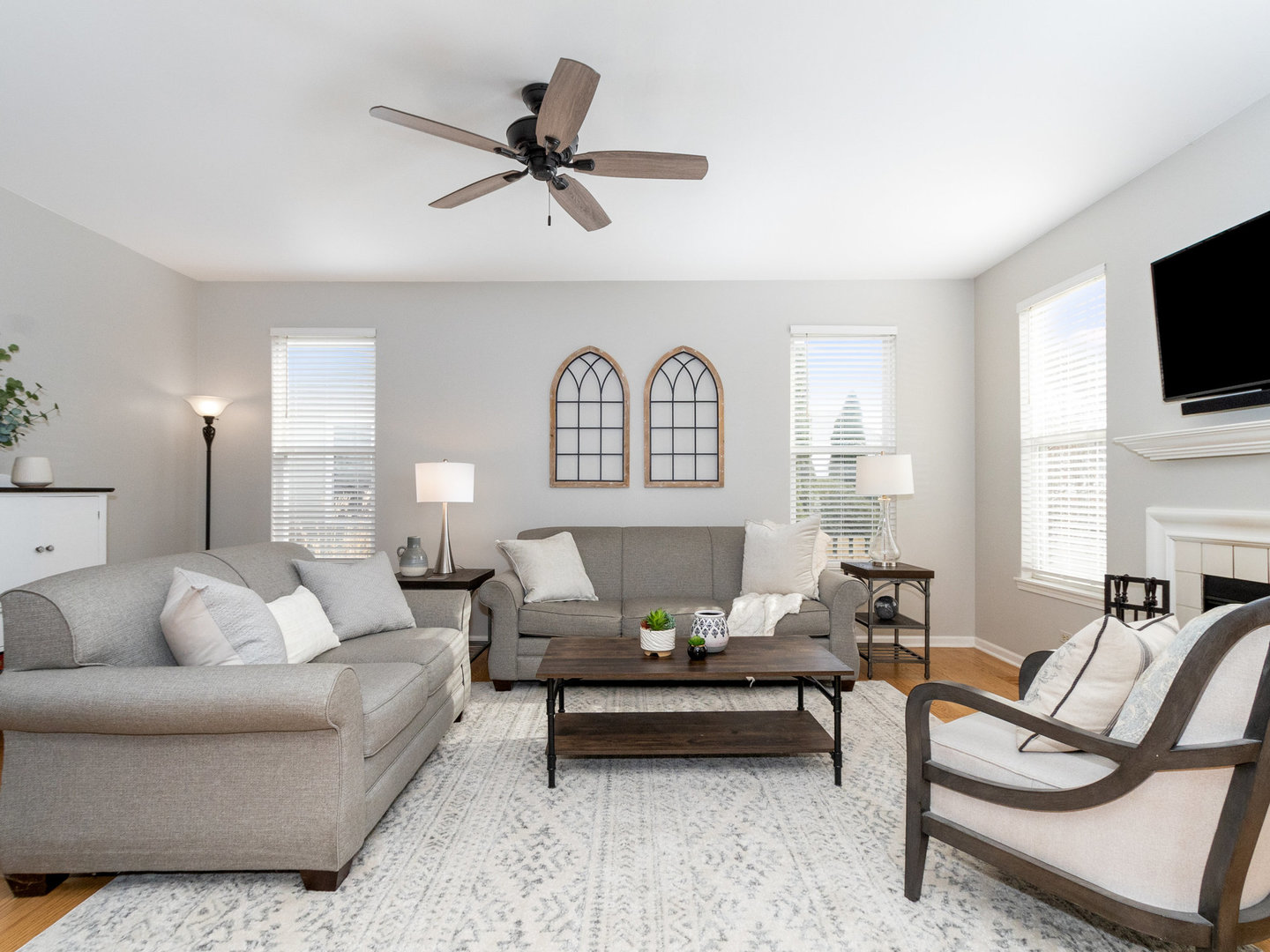 1195 Amaranth Drive Naperville, IL 60564 - Photo 10 of 48 a living room with furniture a flat screen tv and a window